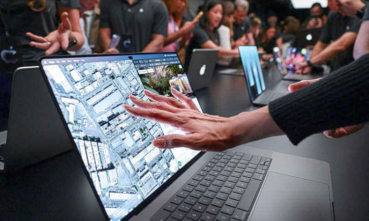 Apple shows pricey touchscreen  laptops, a first for iPhone maker